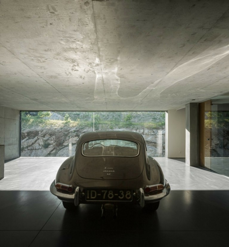 modernt lantligt garage minimalistiskt hus betongtak glasvägg