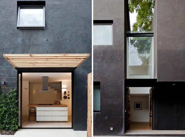 Hall glasvägg minimalistisk modern köksö svart fasad