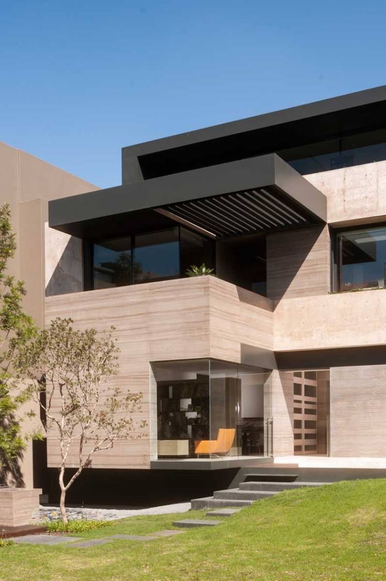 modernt enfamiljshus färgad exponerad betongfasad