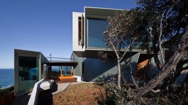 Bostadshus byggnad sluttning stenig kust-Fairhaven Beach-Australien moderna hem