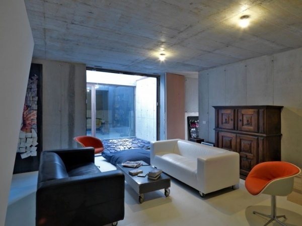vardagsrum trendig källare exponerad betonginredning inredning