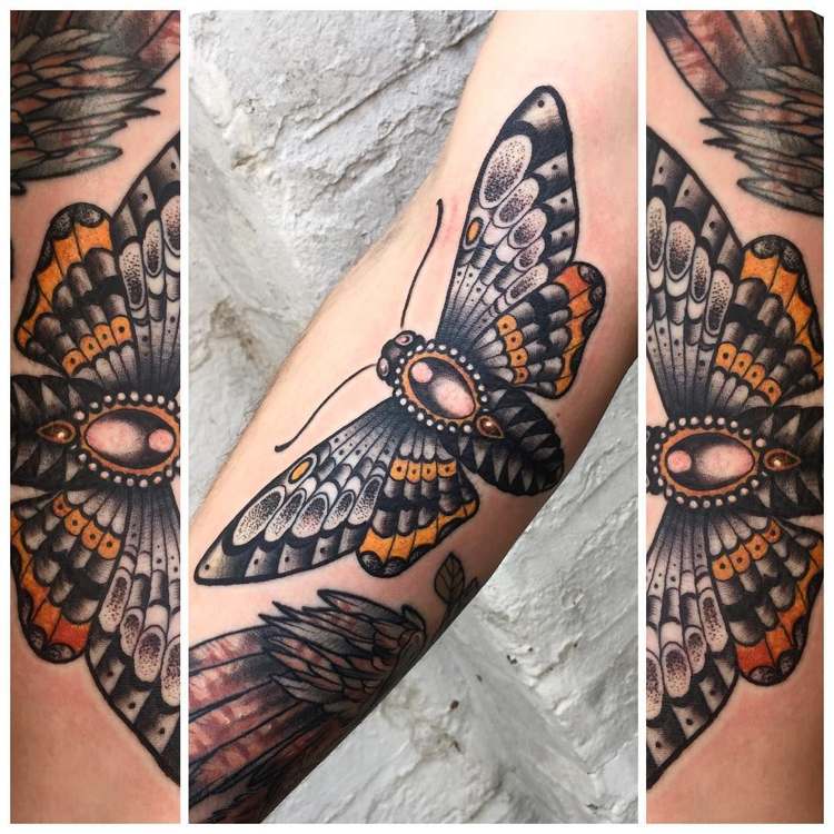 Moth Tattoo Arm Man Orange Accents Jewel