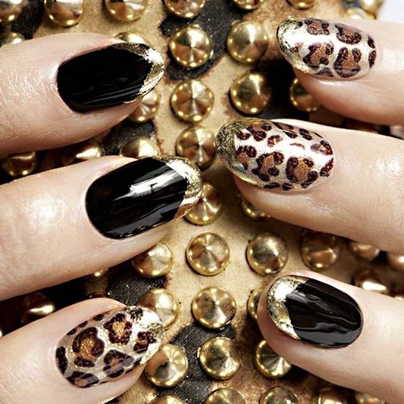 Nageldesign-svart-guld-djur-mönster-svart-nagellack
