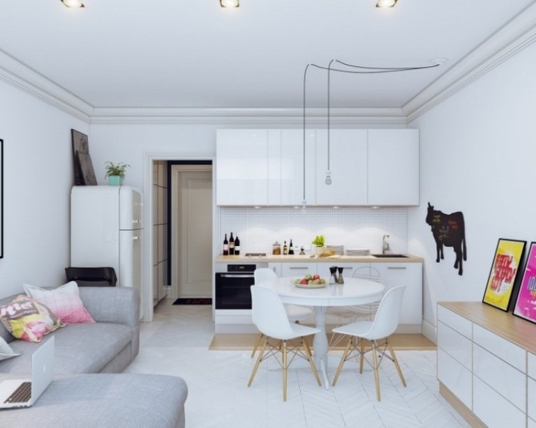 öppet-kök-vardagsrum-modern-vit-hörn-soffa-grå-ko-tavla-krita-modern