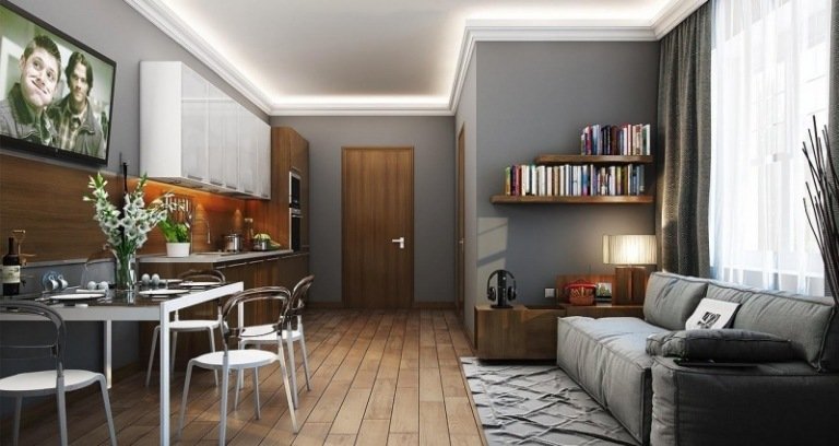 öppet-kök-vardagsrum-grått-trä-soffa-matbord-inbyggt kök-vägg hylla-liten