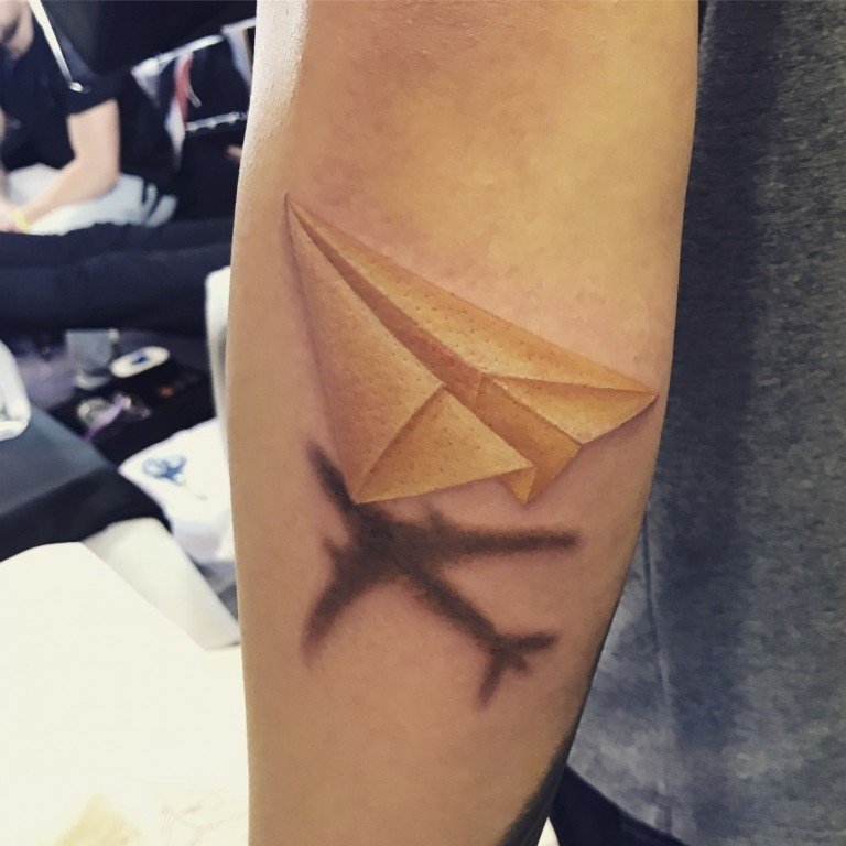 Paper plane tattoo plane shadow wanderlust motiv