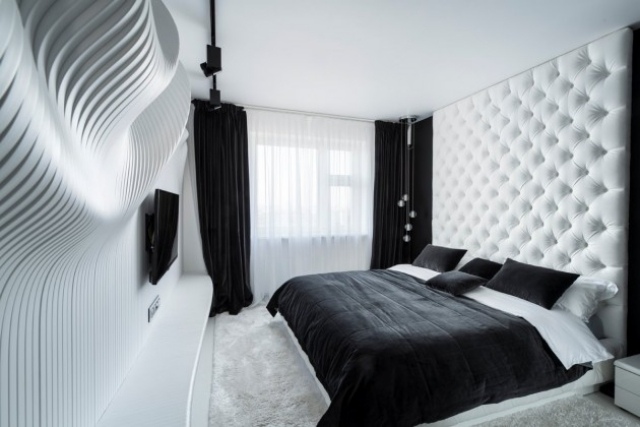 litet sovrum svartvitt väggdekoration quiltad sänggavel