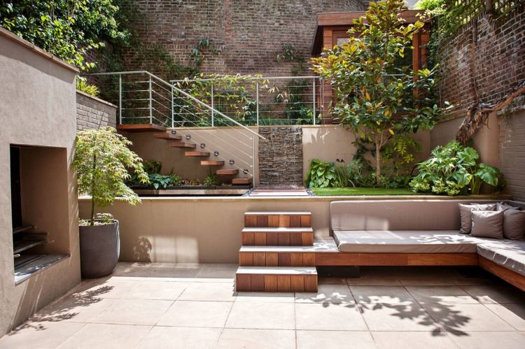 Sänkt trädgård med en sätesdesign-modern-betong-platta-bänk-tegel-murad-tegel vägg-sekretess skärm