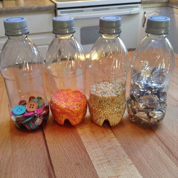 vackra sensoriska flaskor skapar idéer för barn folieknappar