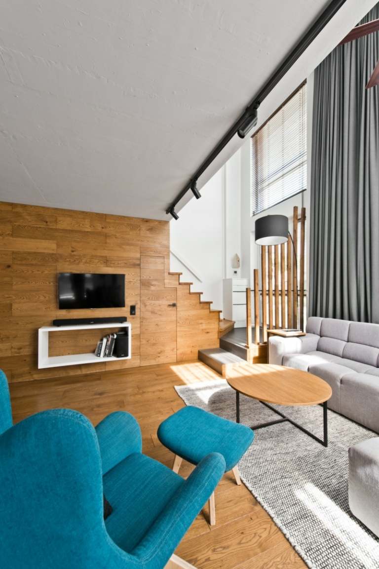 Skandinavisk stil grå inredning möbler idé soffbord runt trä