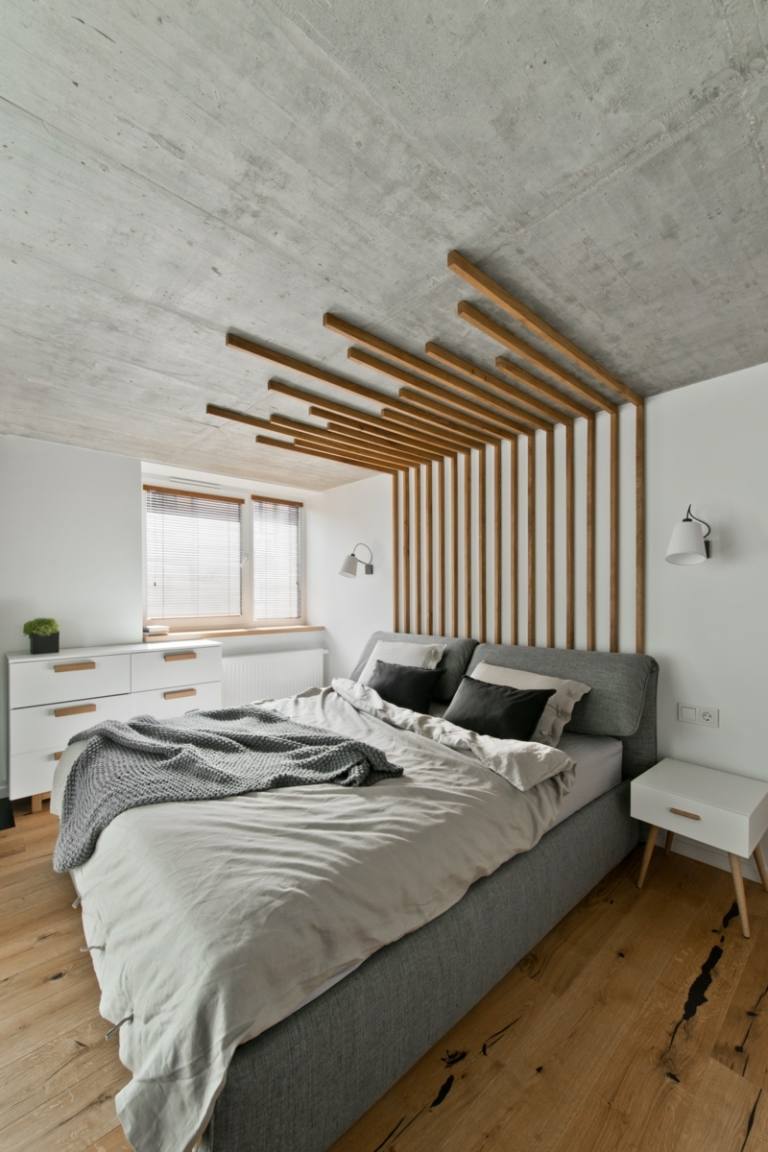 skandinavisk stil i grått betongutseende sovrum sängbord vitt