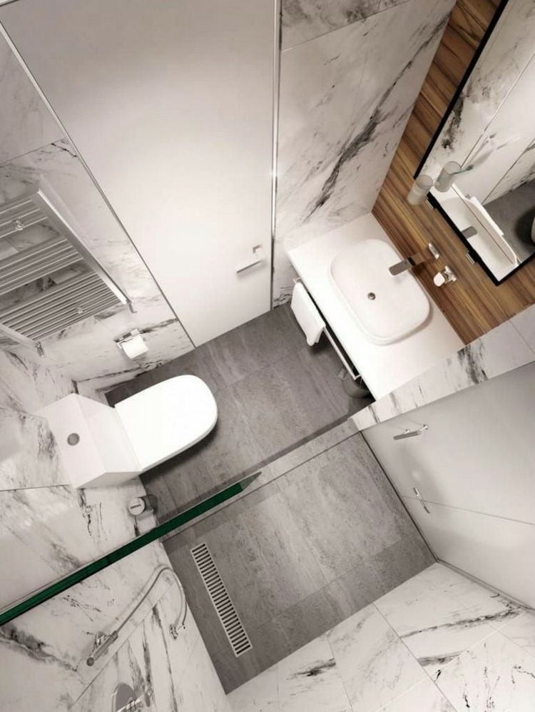 Mini gästtoalett med dusch med silverradiator och marmorplattor