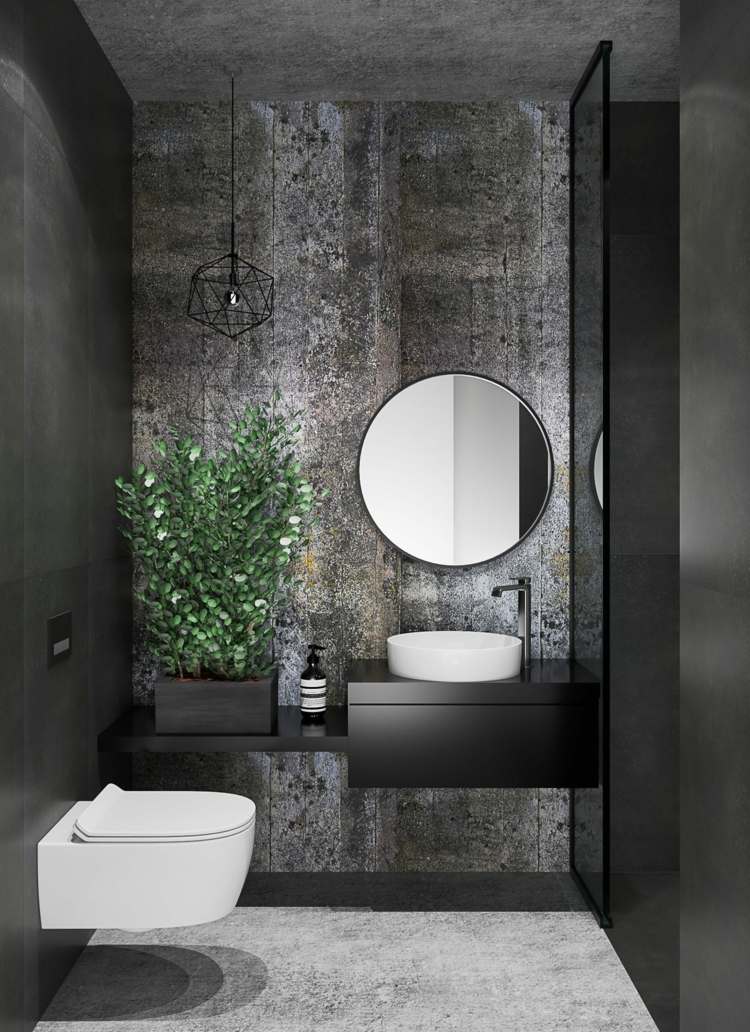 Minimalistisk industriell badrumsdesign i svart för besökare