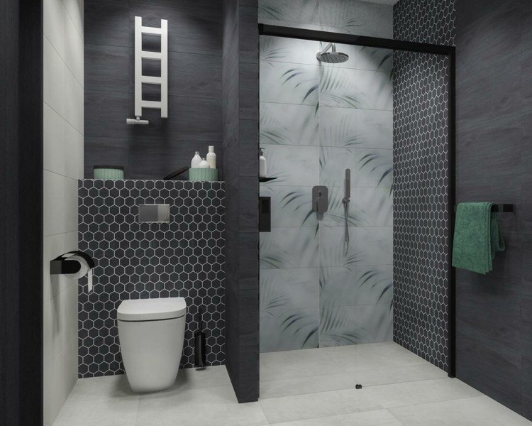 Monokromt gästbadrum med duschkabin på golvnivå och svarta kakel