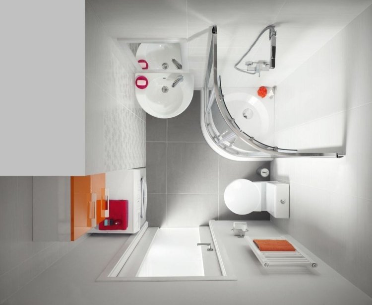 Litet gästbadrum med duschkabin och tvättmaskin i en väggnisch