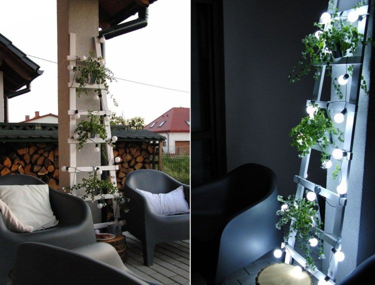 Sommardekoration ute - modern, vit stege med växter och sagoljus