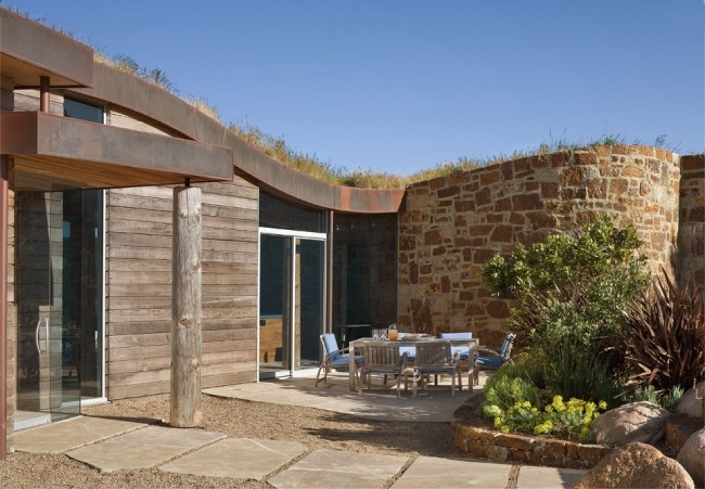modernt hus natursten trä fasad terrass landskap