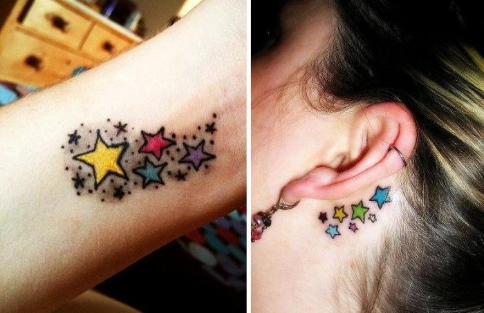 3-stjärnig-tatuering-med-färg-underarm-bakom-örat