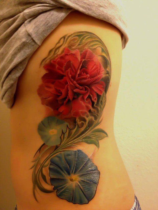 Tatueringsidéer blommor mage sidomotiv kvinna