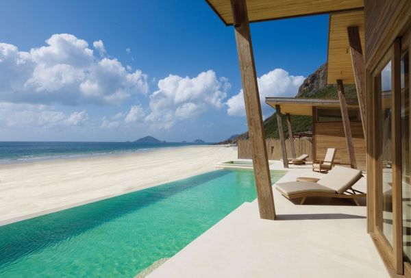 Trävilla Traditionell konstruktion med utsikt över stranden-fin sandpool-Vietnam Six Senses-Con Dao