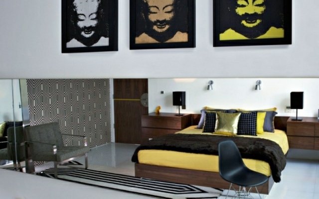 sovrum-retro-modernt-mönster-trä-säng-vägg-konst-bilder-buddha-gul