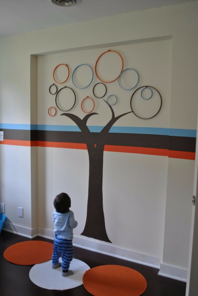 Gör väggdekoration själv barnrumsidé trädpapper ringar färgglada