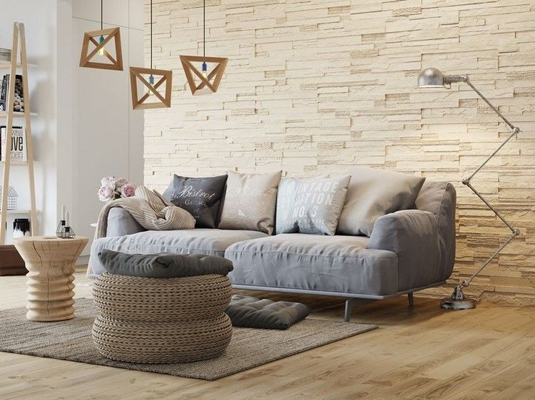 Väggdesign i vardagsrummet sten look-beige-stegu-remmar-grå-soffa