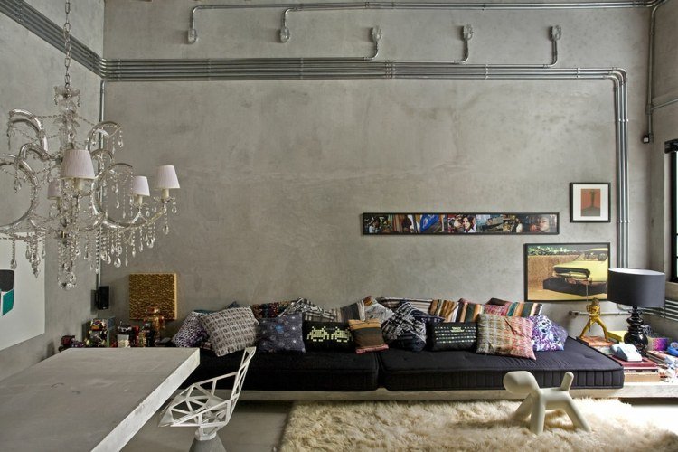 väggdesign-betong-optik-art-deco-ljuskrona-ädel-soffa-svart