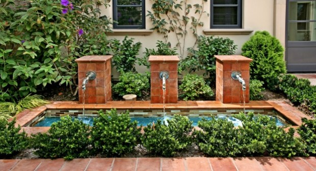 Designer vatten har tegelväggskranar trädgård design modern
