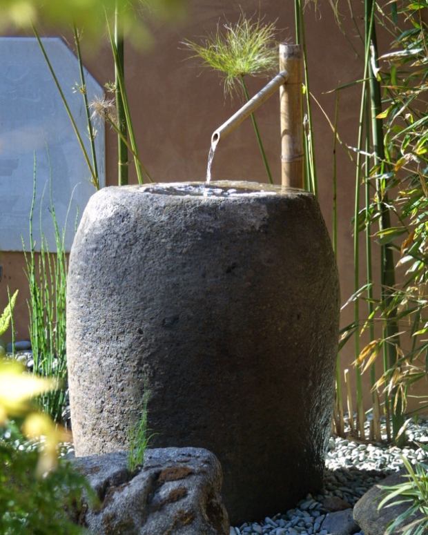 Kran fontän natursten utseende trädgård dekoration designer vatten funktioner