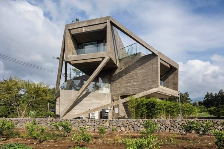 betonghus modern geometrisk arkitektur fönsterglas