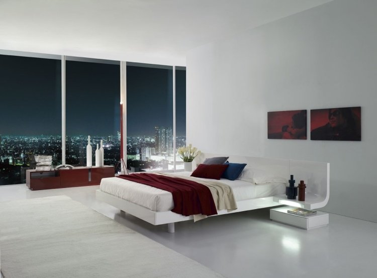 Vita sovrumsmöbler -stil-design-minimalistisk-röd-detaljer-fönster-stad-kvällsvy