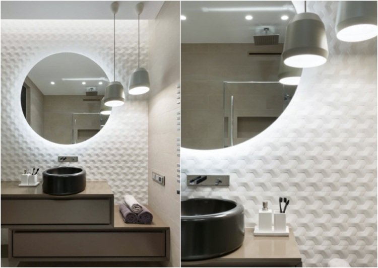 modernt badrum med geometriska plattor bakom ett runt handfat