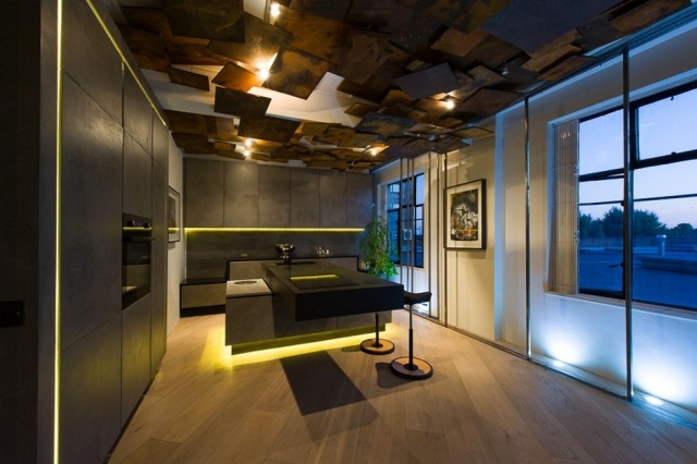 Lägenhet med modern inredning kök betong ö belysning