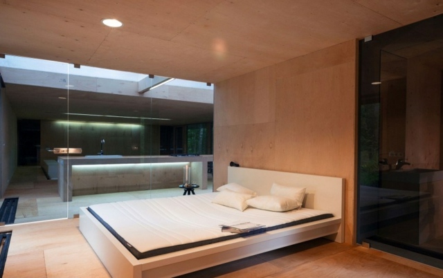 Sovrum-betongplattor-trägolv-väggar av glas