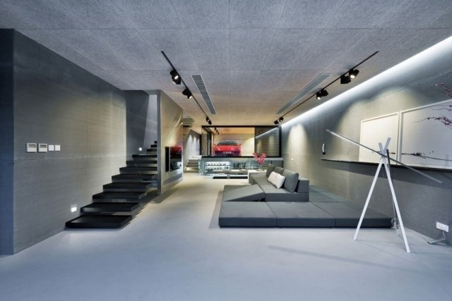 Puristisk-vardagsrum-möblering-modulär-soffa-golv-nivå-vägg-teknik inbyggd