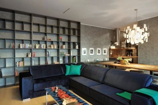 läder-soffa-justerbart-ryggstöd-vardagsrum-design-väggar-betong-look
