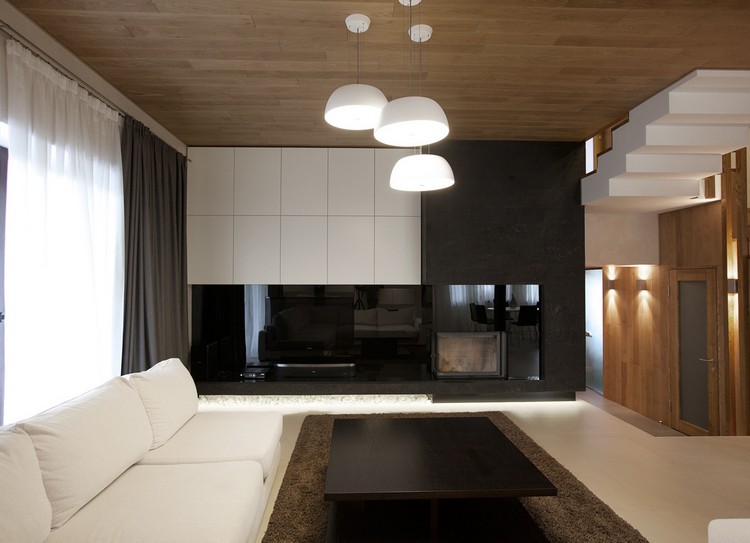 Vardagsrum-grå-svart-högglans väggdel-brun-matta-idéer