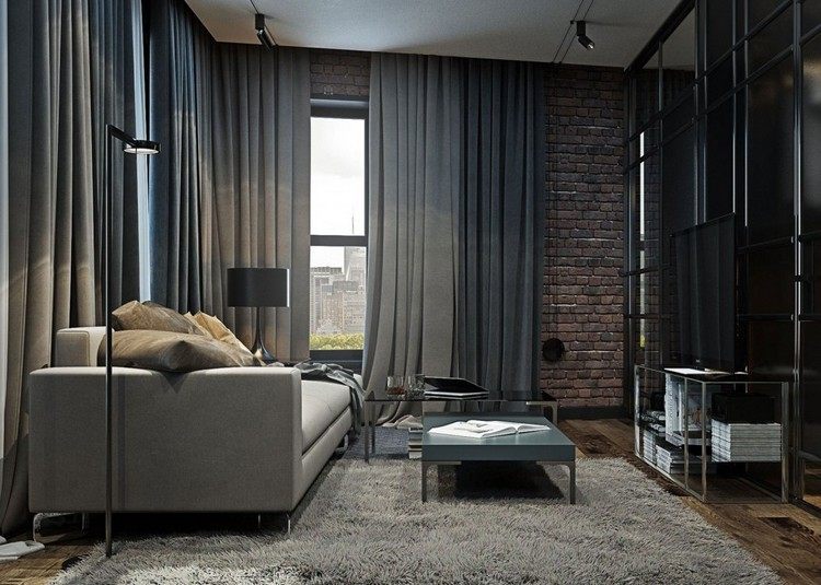 Vardagsrum-grå-gardiner-tegelvägg-svart-möbler