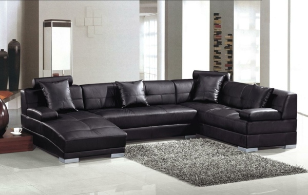 modern-soffa-svart-läder-möbler-vardagsrum