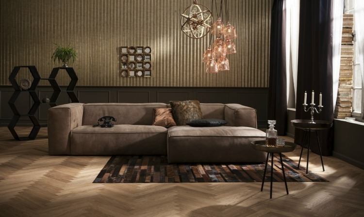 vardagsrumsmöbler hörnsoffa-grå-kare-design-mörk-interiör