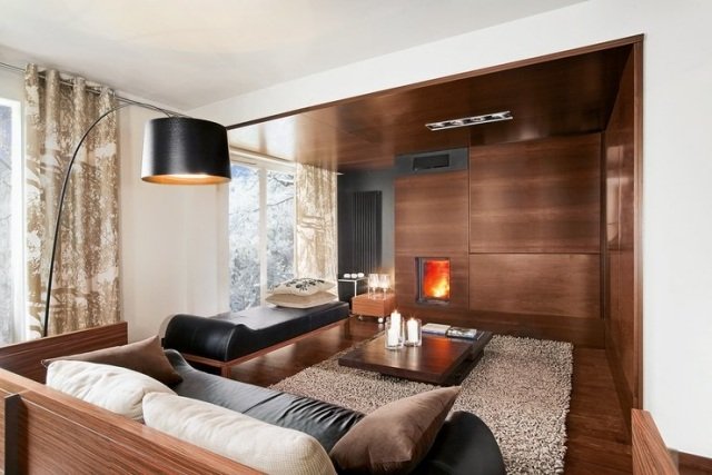 vardagsrum-modern-möblering-trä-möbler-öppen spis väggpaneler