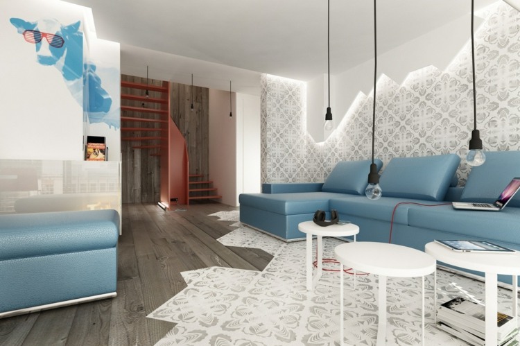 vardagsrum modern inredning stål blå soffa läder hängande lampor tapet silver