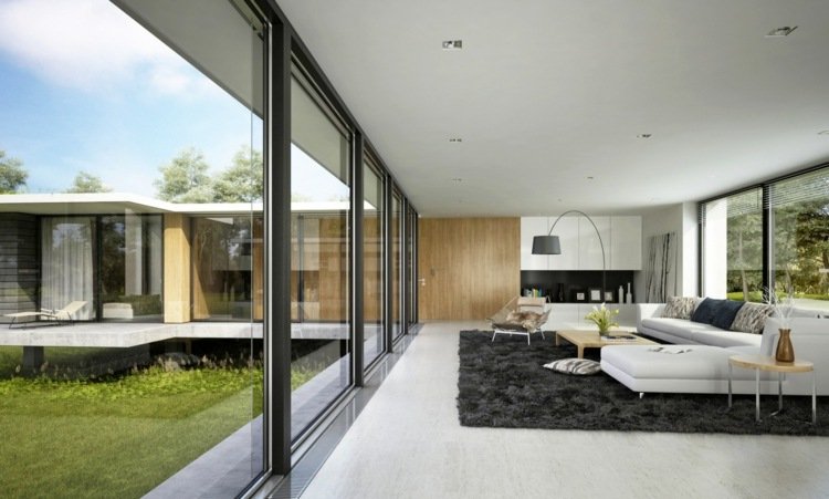 vardagsrum utan TV minimalistisk-stort-fönster-utsikt över trädgården-vit-soffa