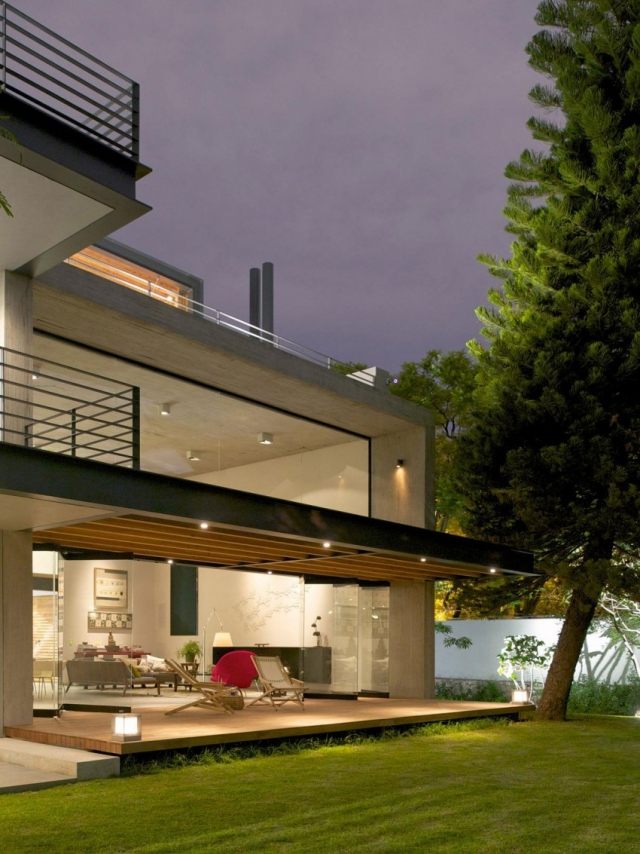 Modernt betonghus-platt tak-fönster-terrass-trädgård
